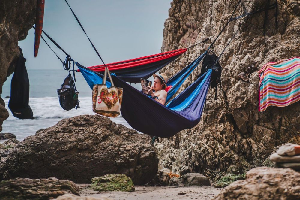 man in hammock at beach