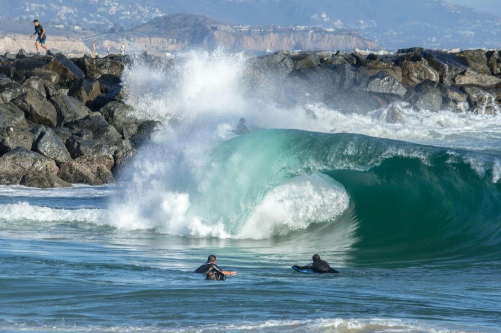 surfers on a wave