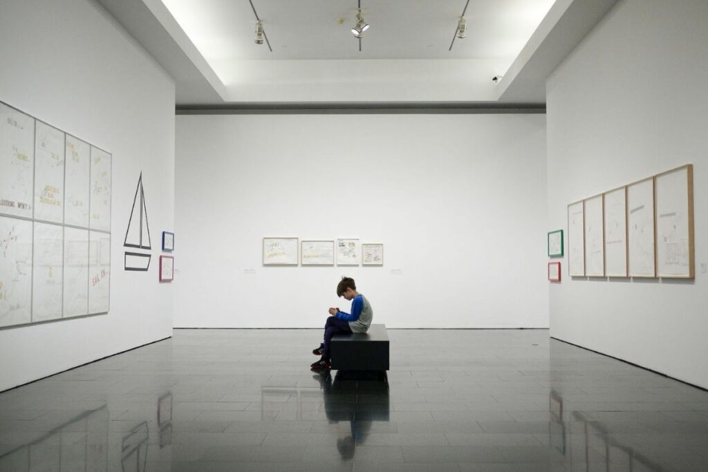 kid sitting in a museum