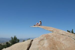 A person sitting on Potato Chip Rock