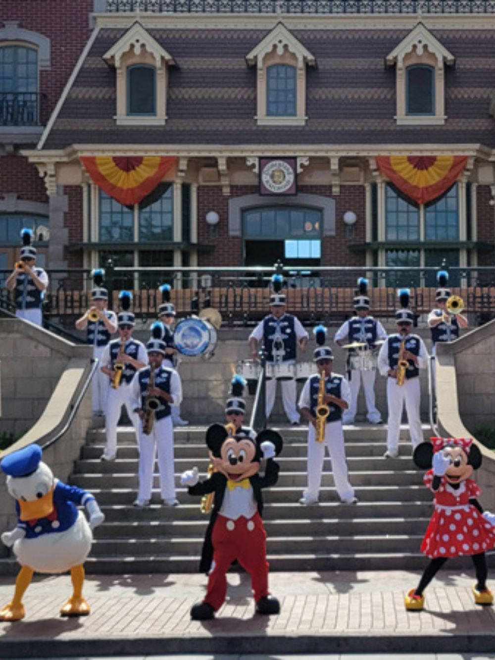Mickey, Minnie, and Donald at the train station in Disneyland.