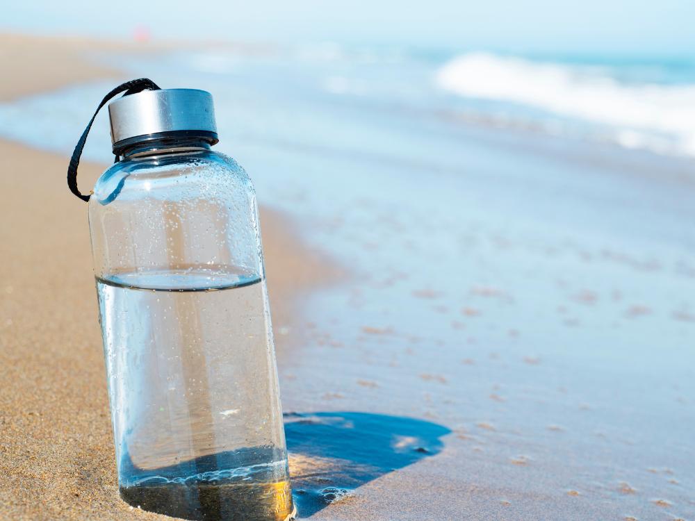 Water bottle on the beach